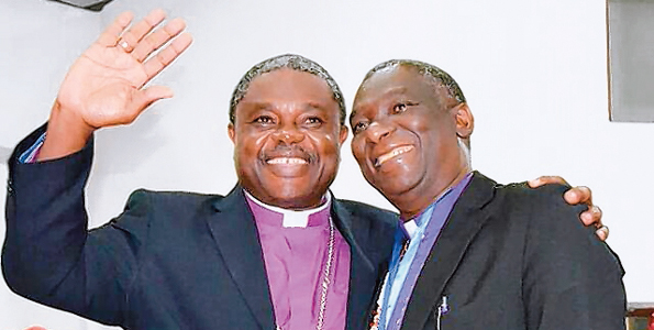 Outgoing Presiding Bishop Alex Malasusa waves with Bishop Elect Frederick Shoo after the latter’s election to serve as head of the Evangelical Lutheran Church of Tanzania.