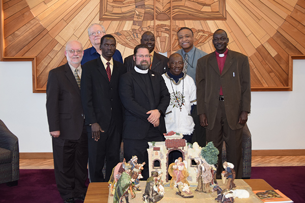 Back: Dr. Curtis Peters, John Ater Deng, Rev. Larry Vogel, Abraham, and Rev. Roosevelt Gray. Front: Dr. Albert Collver, Dr. John Loum, and Bishop Elijah Arok.
